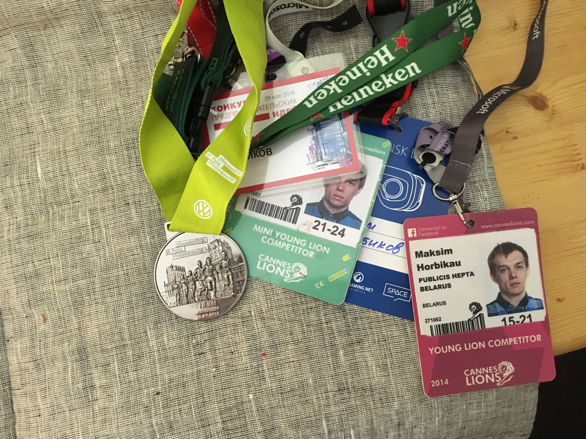Max’s collection of conference passes, including Young Lions competitor badges